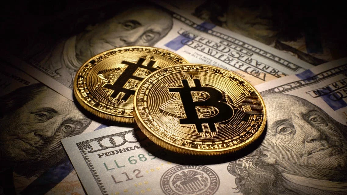 محطمةً الأرقام القياسية.. البيتكوين تتجاوز عتبة 60 ألف دولار